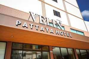 a hotel sign on the front of a building at VELIN Pattaya Hotel in Pattaya