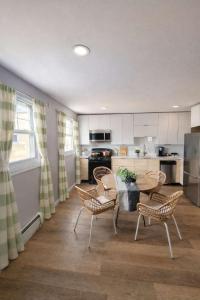 a kitchen with a table and chairs and a table and chairsktop at Jefferson Sr - 20 mins to Manhattan, NYC in West New York