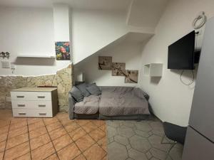 a bedroom with a bed and a television in it at Fabian Appartament in Bagheria