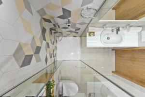 a bathroom with a sink and a toilet at Aura apartamentai in Druskininkai +22 photos