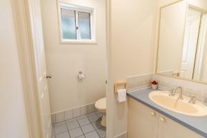 a bathroom with a sink and a toilet at Hargreaves House in Bright +22 photos