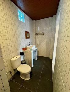 a bathroom with a toilet and a sink at Diana House in Amed in Amed +7 photos