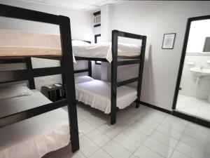 Postel nebo postele na pokoji v ubytování Jer`s Hostal