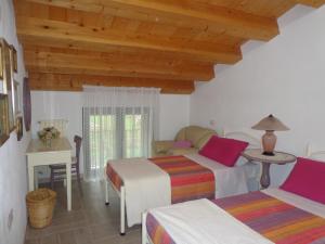 A bed or beds in a room at Agriturismo Sorgente di Luna