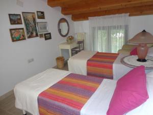 A bed or beds in a room at Agriturismo Sorgente di Luna
