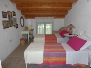 A bed or beds in a room at Agriturismo Sorgente di Luna
