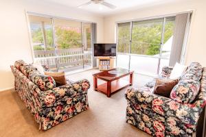 a living room with two couches and a tv at Hargreaves House in Bright
