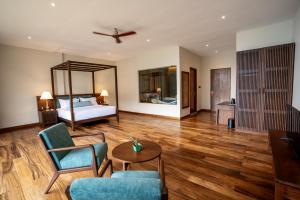 a living room with a bed and a table and chairs at Oak Ray Tea Bush in Ramboda +119 photos