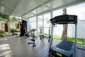 a gym with treadmills and a treadmill at La Rocca Scavata in Rilievo