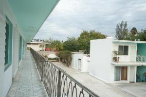 a balcony of a white building with a fence at Hotel La Siesta, Gomez Palacio in Gómez Palacio +46 photos