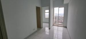 an empty room with a view of a balcony at Apartement ayodhya 2BR Unfurnished in Tjikokol
