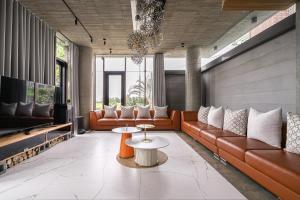 a living room with a couch and a table at 135 會館 135 Private Villa Yilan in Dongshan +41 photos