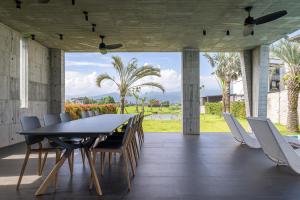 a dining room with a table and chairs at 135 會館 135 Private Villa Yilan in Dongshan