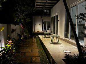 a patio with a table in the middle of a building at The Cove Beach Resort in Cochin