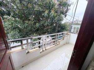 a balcony with a green wall of plants at Ninh Binh Friendly Hotel in Ninh Binh