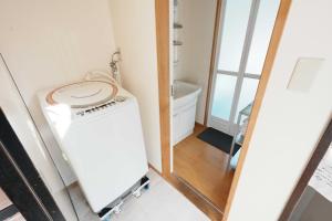 a bathroom with a washer and dryer in a room at SAMURISE No.4 in Fujikawaguchiko +33 photos