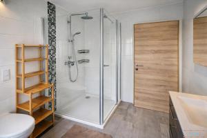 a bathroom with a shower and a toilet at Hidden Gem Near the Moselle River in Grevenmacher