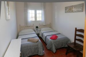 Ένα ή περισσότερα κρεβάτια σε δωμάτιο στο En casa de Carlos