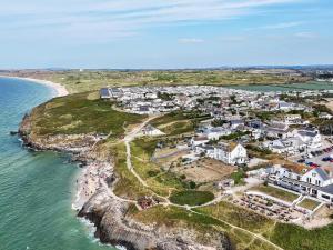 an aerial view of a town next to the ocean at The Sandbox in Hayle