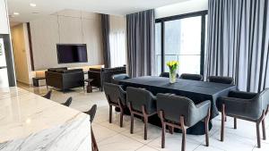 a conference room with a table and chairs and a television at Grand Ion Delemen Plus in Genting Highlands