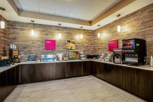 a fast food restaurant with a counter with pink signs at Comfort Suites Fishkill near Interstate 84 in Fishkill