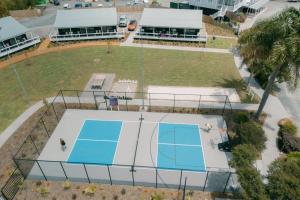 an overhead view of a tennis court with a tennis court at Tasman Holiday Parks - Miranda in Miranda +114 photos