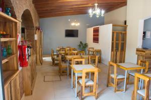 Reštaurácia alebo iné gastronomické zariadenie v ubytovaní Apart Hotel Lo de Carilo