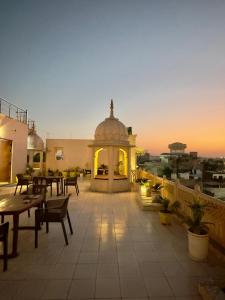 a patio with a gazebo on top of a building at The Taj Vista Agra -walking distance to Taj Mahal in Agra