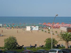a beach filled with people on a sunny day at Hotel President in Vasto