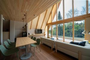 a living room with a couch and a table at ERUSA Rusutsu in Rusutsu
