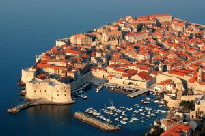 an aerial view of a city with boats in the water at Hotel Kompas in Dubrovnik