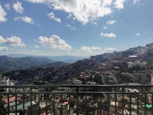 a view of a city from the top of a building at Fanai Inn in Āīzawl