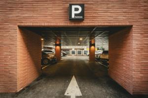 a garage with a parking lot with cars in it at Hotel Solide Cheonan in Cheonan