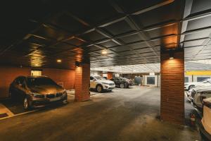 a parking garage with cars parked in it at Hotel Solide Cheonan in Cheonan +58 photos