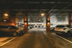 a parking garage with cars parked in it at Hotel Solide Cheonan in Cheonan