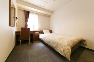 Postel nebo postele na pokoji v ubytování Hotel Ohedo