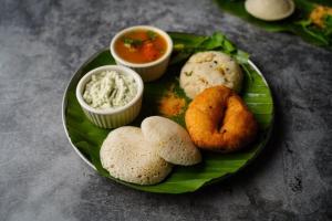 a plate of food with different types of food on it at Pleasant Memories in Kodaikānāl