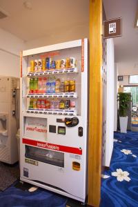 a refrigerator that has a lot of magnets on it at Hotel Bliss Villa Hasami in Hasami
