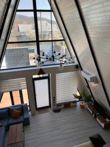 an overhead view of a living room with large windows at Aframezing Gabala in Gabala +34 photos