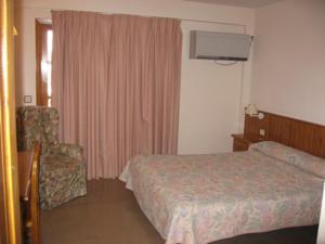 Postel nebo postele na pokoji v ubytování Hotel Anaya