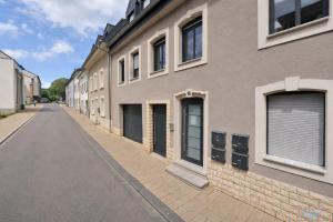 an empty street in front of a building at Hidden Gem Near the Moselle River in Grevenmacher