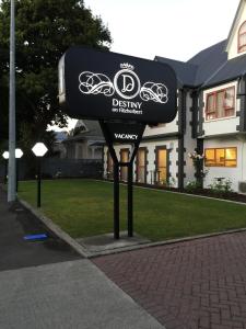 a sign for a bike shop in front of a house at ASURE Destiny on Fitzherbert Motel in Palmerston North