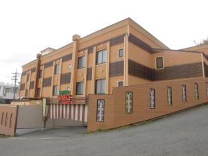 a brown building with a lot of windows at Sari Resort Kashiba (Adult Only) in Kashiba