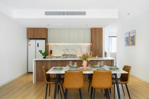 a kitchen and dining room with a table and chairs at 4BR Spacious Townhouse in Box Hill in Annangrove