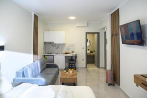 a living room with a couch and a table at Coastline 1 in Perea