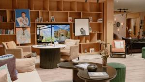 a room filled with furniture and a table in a room at Ambiance Resort Hunza in Hunza Valley
