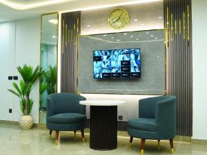 Et tv og/eller underholdning på Gold Pine Hotel Mall Road