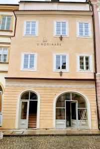 a store front of a building with white windows at Apartmán 19 in Mikulov