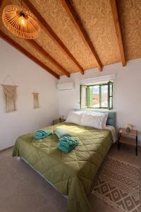 a bedroom with a large bed in a room at Villa Emerald in Koskinou +59 photos