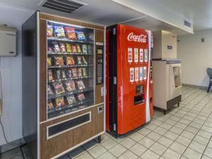 a coca cola vending machine next to a refrigerator at Motel 6-Yreka, CA in Yreka